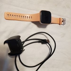 FitBit Versa 2 with charging cable